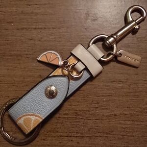Coach Trigger Trap Light Blue With Orange Leather Bag Charm